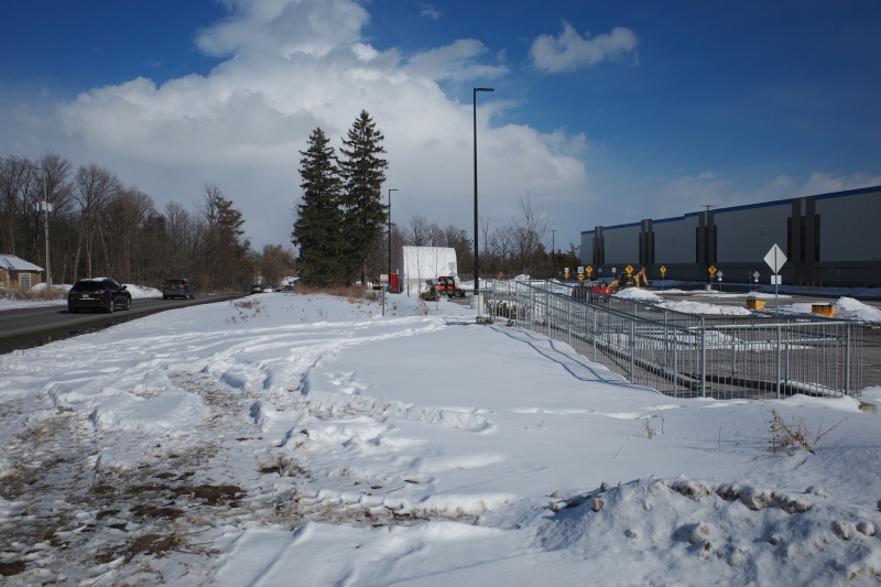 Looking east on Steeles from Tapscott Road – despite the sign advising motorists of pedestrian activity, there are no sidewalks leading east towards the new Amazon fulfillment centre (Sonali Praharaj)