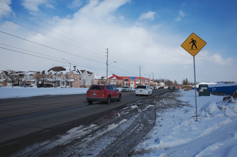 Looking east on Steeles from Tapscott Road – despite the sign advising motorists of pedestrian activity, there are no sidewalks leading east towards the new Amazon fulfillment centre (Sonali Praharaj)